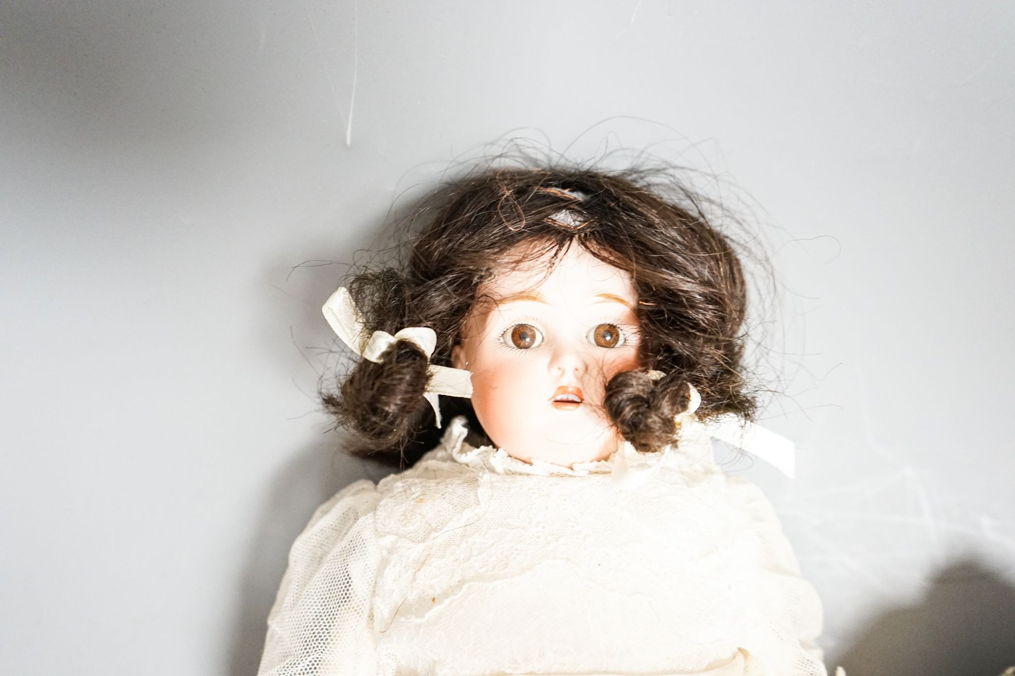 J D Kestner, bisque doll and a Schwenau & Hoffmeister bisque head